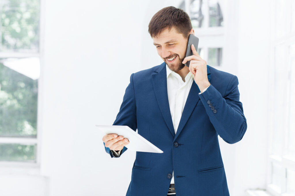 portrait businessman talking phone office