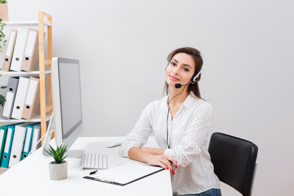 charming woman desk wearing headset 23 2148434720