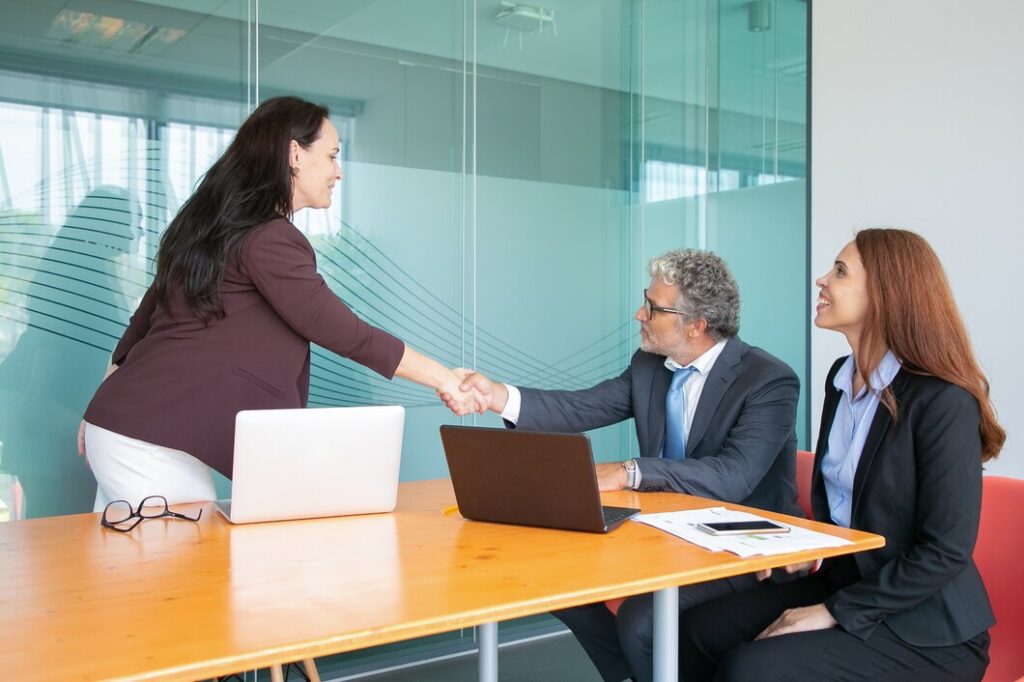 Top 10 Sales Outsourcing Companies in Washington 2025: Boost Your Business Growth 4 experienced grey haired ceo sitting greeting businesswoman 74855 9872