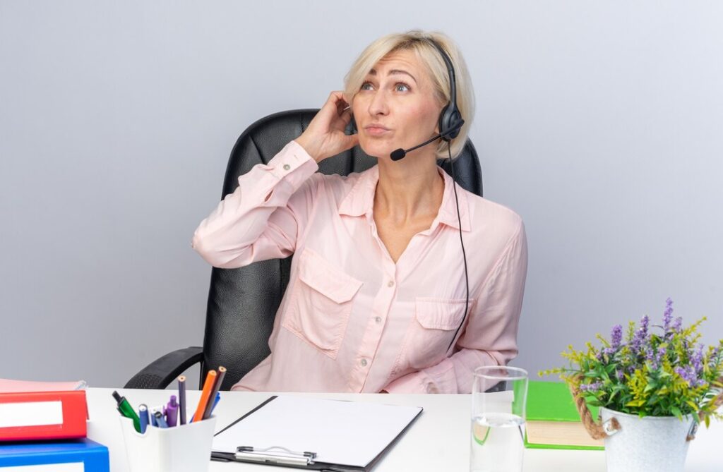 Top 10 Cold Calling Services in Washington 2025: Boost Your Sales with Expert Outreach 8 thinking young female call center operator wearing headset sitting table with office tools isolated white wall 141793 130183