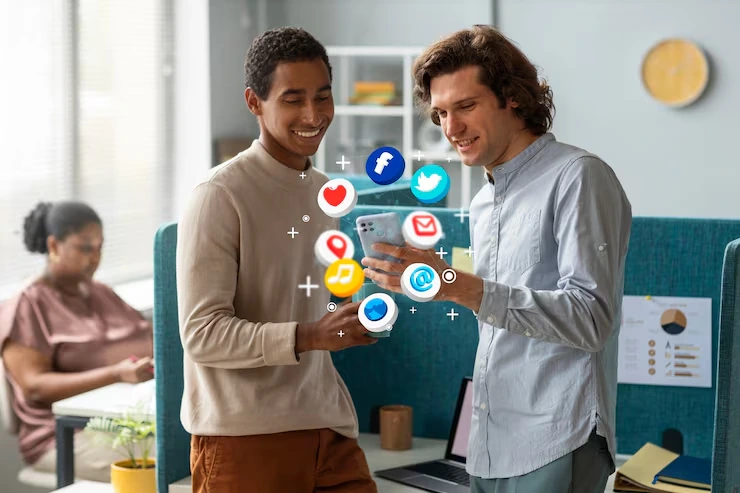 Two professionals using tablet with floating social media icons representing lead generation from social platforms
