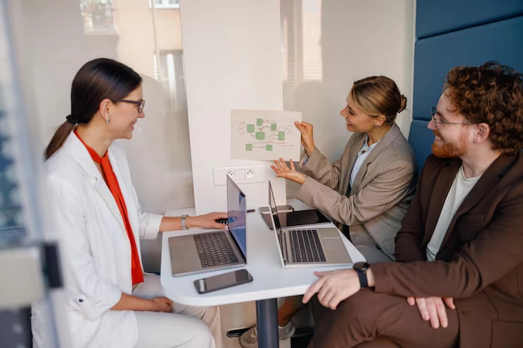 Email Marketing For Healthcare 32 Healthcare consultant presenting patient journey flowchart to medical professionals using laptops